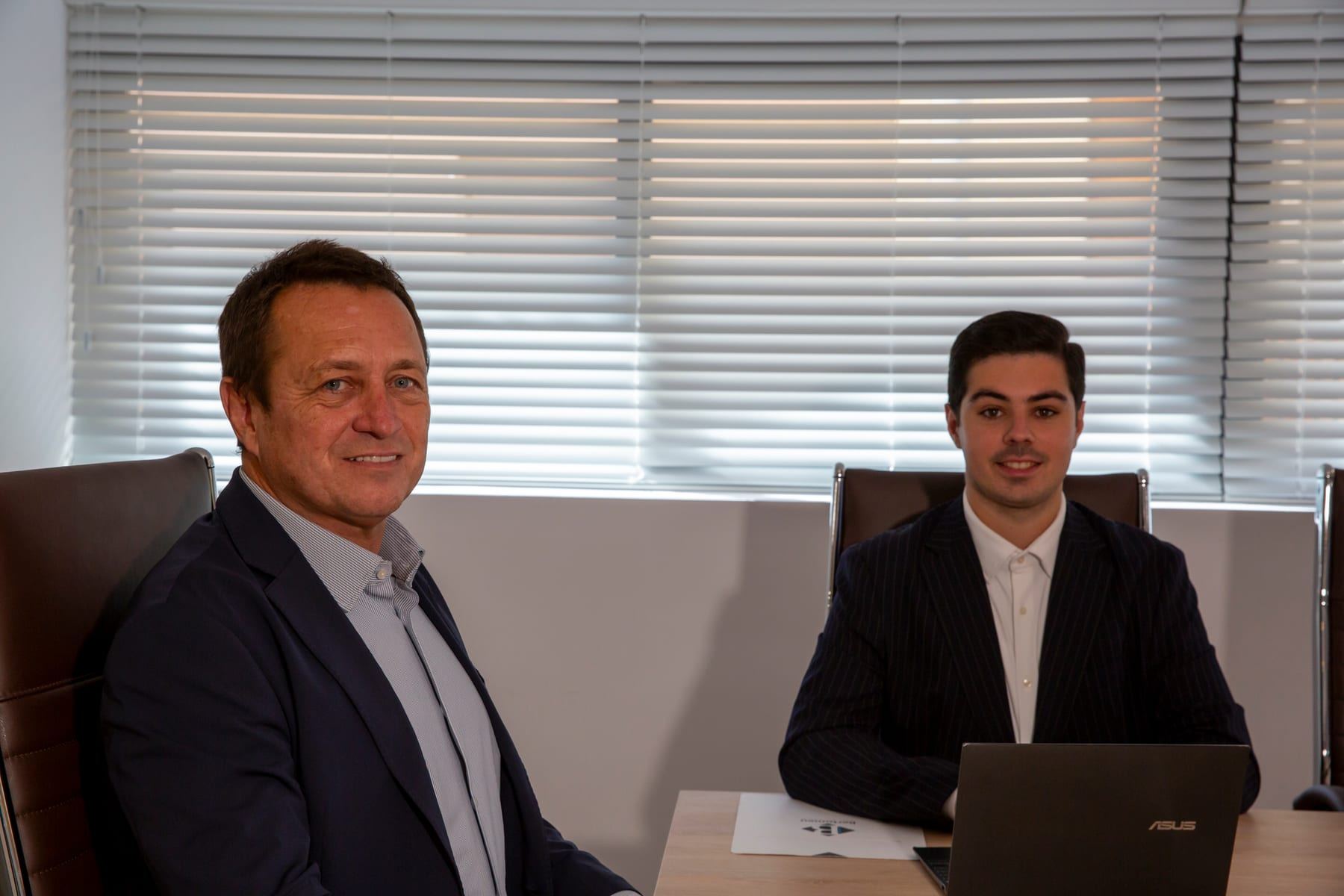 Juan and Daniel Bertomeu at their desk in the Expat Abogados office