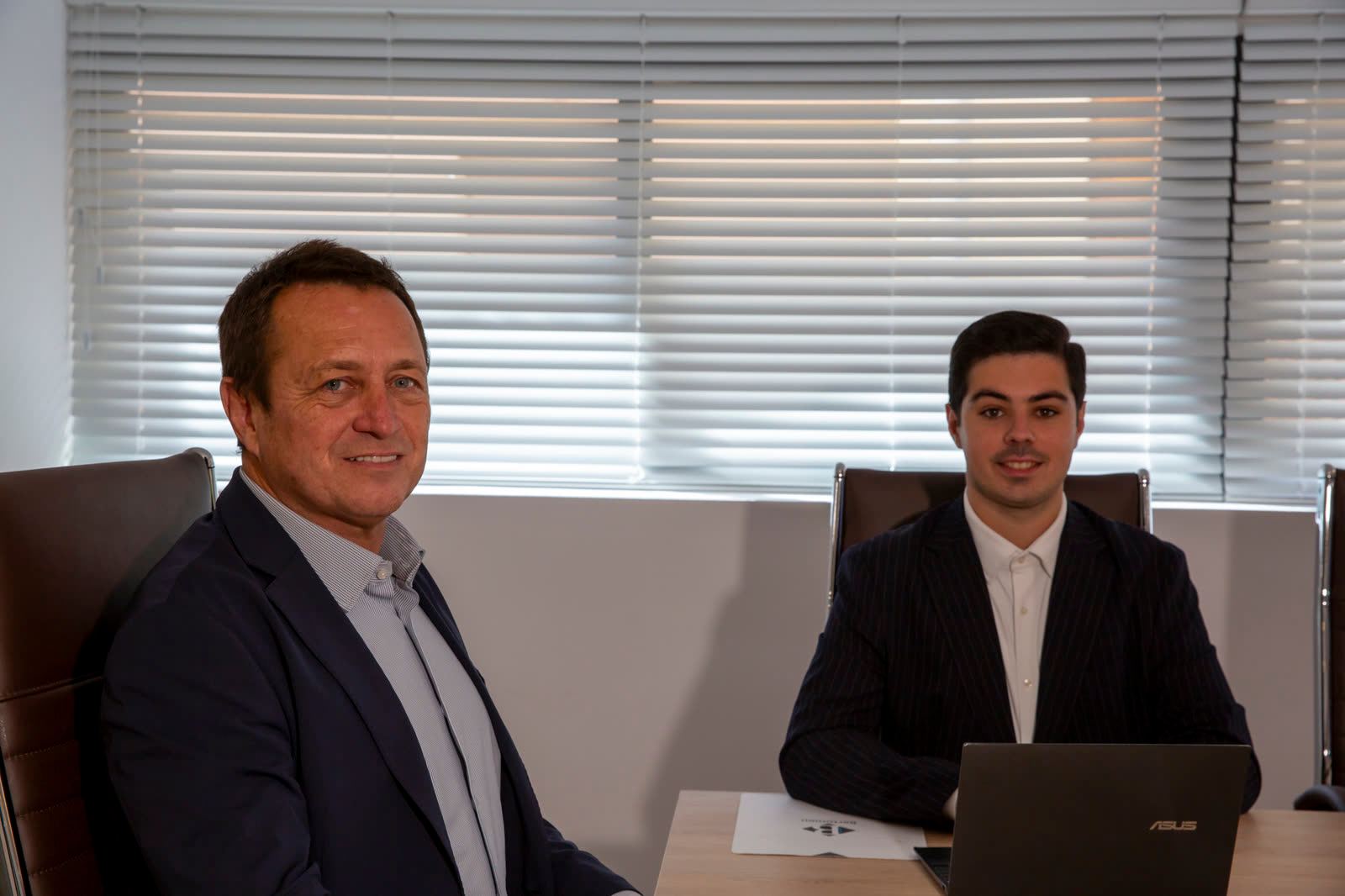 Juan and Daniel Bertomeu at their desk in the Expat Abogados office